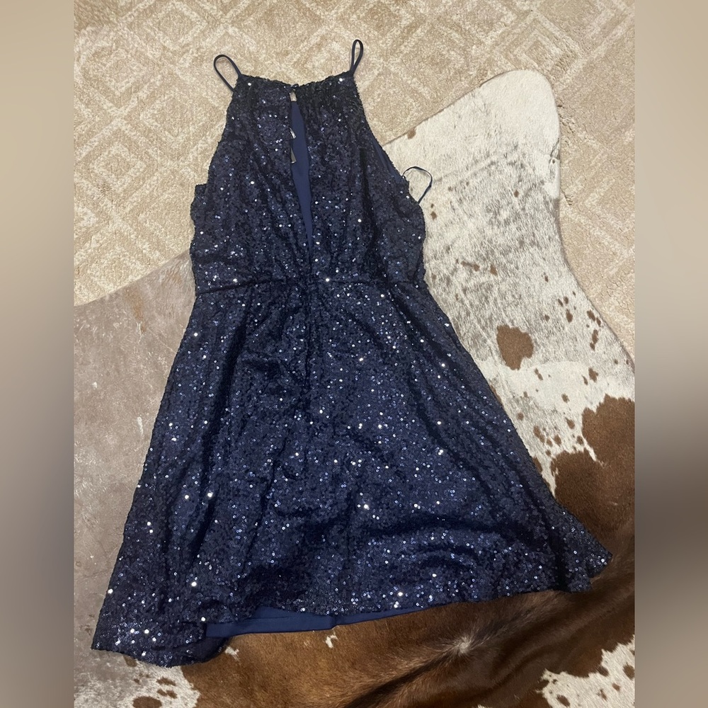 May and July blue sparkles dress with an open back